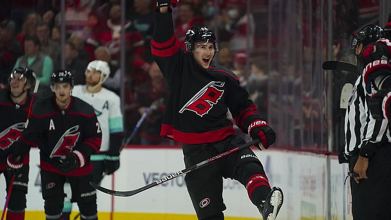 Mar 6, 2022; Raleigh, North Carolina, USA; Carolina Hurricanes center Martin Necas (88) celebrates his goal against the Seattle Kraken during the third period at PNC Arena. Mandatory Credit: James Guillory-USA TODAY Sports