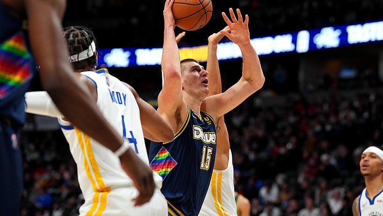 Mar 7, 2022; Denver, Colorado, USA; Denver Nuggets center Nikola Jokic (15) shoots the ball in the first quarter against the Golden State Warriors at Ball Arena. Mandatory Credit: Ron Chenoy-USA TODAY Sports