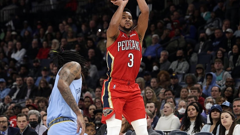 Mar 8, 2022; Memphis, Tennessee, USA; New Orleans Pelicans guard CJ McCollum (3) shoots for three during the second half against the Memphis Grizzlies at FedExForum. Mandatory Credit: Petre Thomas-USA TODAY Sports