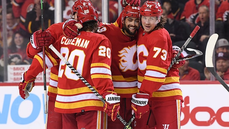 Mar 8, 2022; Calgary, Alberta, CAN; Calgary Flames defenseman Oliver Kylington (58) celebrates his third period goal against the Washington Capitals at Scotiabank Saddledome. Mandatory Credit: Candice Ward-USA TODAY Sports