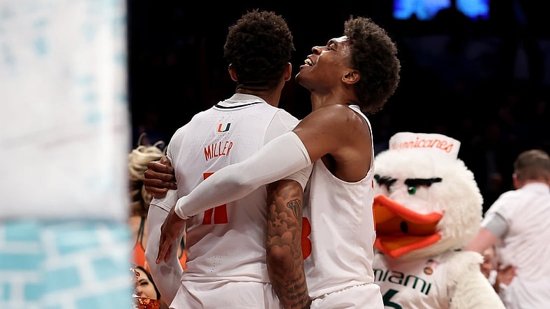 Mar 10, 2022; Brooklyn, NY, USA; Miami Hurricanes guard Jordan Miller (11) celebrates his buzzer beater layup with guard Charlie Moore (3) to beat the Boston College Eagles during overtime at Barclays Center. Mandatory Credit: Brad Penner-USA TODAY Sports