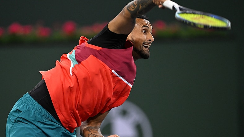 Mar 10, 2022; Indian Wells, CA, USA; Nick Kyrgios (AUS) hits a shot in his first round match against Sebastian Baez (not pictured) on day 4 at the BNP Paribas Open at the Indian Wells Tennis Garden. Mandatory Credit: Jayne Kamin-Oncea-USA TODAY Sports