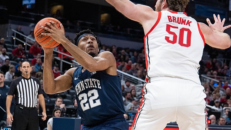 Mar 10, 2022; Indianapolis, IN, USA; Penn State Nittany Lions guard Jalen Pickett (22) looks to shoot the ball while Ohio State Buckeyes center Joey Brunk (50) defends in the second half at Gainbridge Fieldhouse. Mandatory Credit: Trevor Ruszkowski-USA TODAY Sports