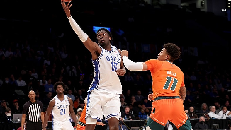 Mar 11, 2022; Brooklyn, NY, USA; Duke Blue Devils center Mark Williams (15) drives to the basket against Miami Hurricanes guard Jordan Miller (11) during the first half of the ACC Tournament semifinal game at Barclays Center. Mandatory Credit: Brad Penner-USA TODAY Sports