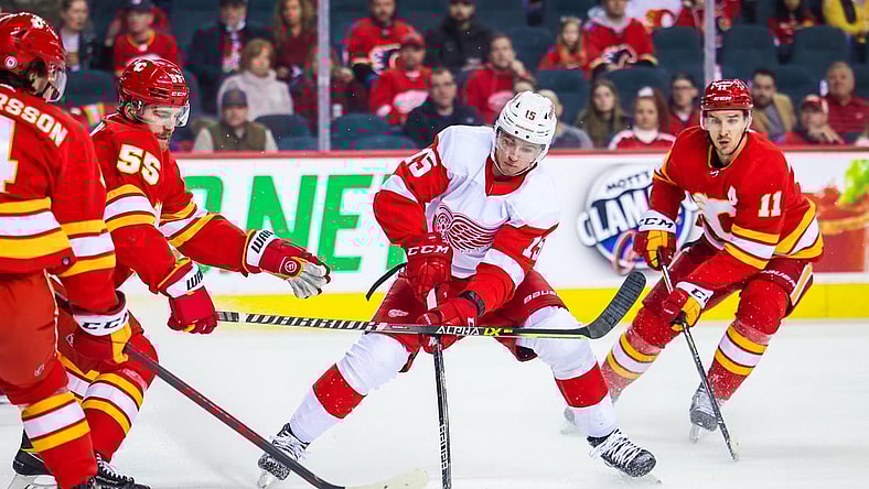 Mar 12, 2022; Calgary, Alberta, CAN; Detroit Red Wings left wing Jakub Vrana (15) controls the puck against the Calgary Flames during the first period at Scotiabank Saddledome. Mandatory Credit: Sergei Belski-USA TODAY Sports