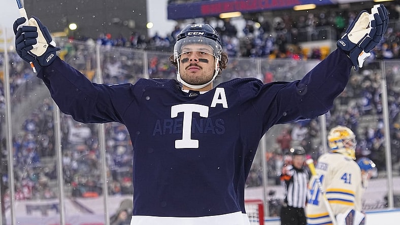 Mar 13, 2022; Hamilton, Ontario, CAN; Toronto Maple Leafs forward Auston Matthews (34) celebrats his goal against Buffalo Sabres goaltender Craig Anderson (41) during the second period in the 2022 Heritage Classic ice hockey game at Tim Hortons Field. Mandatory Credit: John E. Sokolowski-USA TODAY Sports