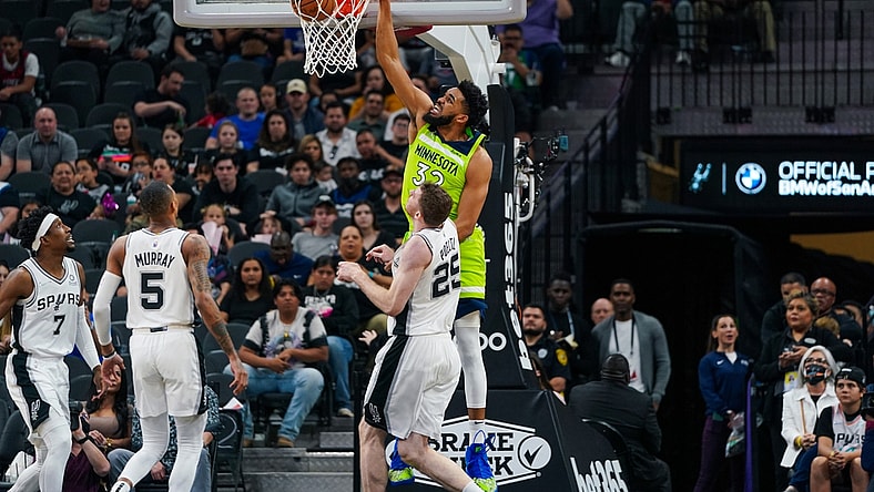 Mar 14, 2022; San Antonio, Texas, USA; Minnesota Timberwolves center Karl-Anthony Towns (32) dunks in the first half against the San Antonio Spurs at the AT&T Center. Mandatory Credit: Daniel Dunn-USA TODAY Sports