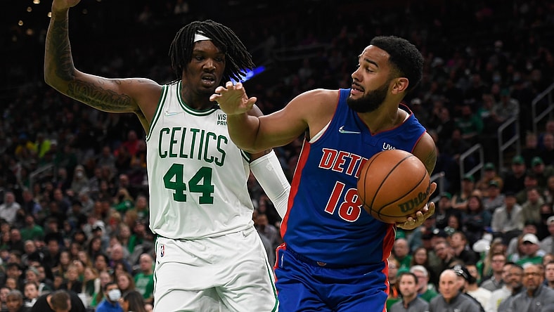 Mar 11, 2022; Boston, Massachusetts, USA;  Detroit Pistons guard Cory Joseph (18) looks to pass the ball while Boston Celtics center Robert Williams III (44) defends during the first half at TD Garden. Mandatory Credit: Bob DeChiara-USA TODAY Sports