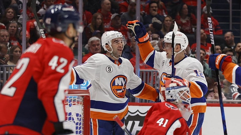 Mar 15, 2022; Washington, District of Columbia, USA; New York Islanders right wing Kyle Palmieri (21) celebrates with Islanders right wing Josh Bailey (12) after scoring a goal on Washington Capitals goaltender Vitek Vanecek (41) in the second period at Capital One Arena. Mandatory Credit: Geoff Burke-USA TODAY Sports