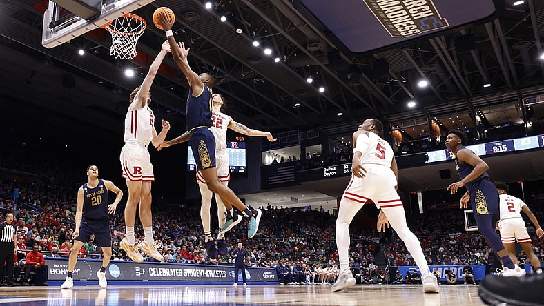 Mar 16, 2022; Dayton, Ohio, USA; Notre Dame Fighting Irish guard Blake Wesley (0) shoots the ball defended by Rutgers Scarlet Knights guard Jalen Miller (2) in the first half at University of Dayton Arena. Mandatory Credit: Rick Osentoski-USA TODAY Sports