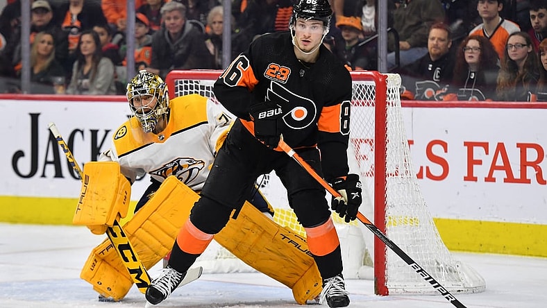 Mar 17, 2022; Philadelphia, Pennsylvania, USA; Philadelphia Flyers left wing Joel Farabee (86) screens Nashville Predators goaltender Juuse Saros (74) during the second period at Wells Fargo Center. Mandatory Credit: Eric Hartline-USA TODAY Sports