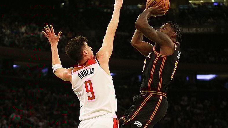 Mar 18, 2022; New York, New York, USA; New York Knicks forward Julius Randle (30) takes a shot against Washington Wizards forward Deni Avdija (9) during the second half at Madison Square Garden. Mandatory Credit: Andy Marlin-USA TODAY Sports