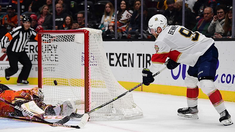 Mar 18, 2022; Anaheim, California, USA; Anaheim Ducks goaltender John Gibson (36) blocks a shot against Florida Panthers center Sam Bennett (9) during the third period at Honda Center. Mandatory Credit: Gary A. Vasquez-USA TODAY Sports