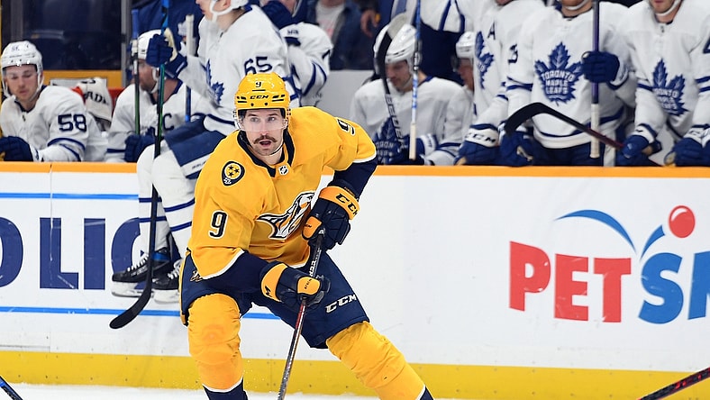 Mar 19, 2022; Nashville, Tennessee, USA; Nashville Predators left wing Filip Forsberg (9) handles the puck against the Toronto Maple Leafs during the first period at Bridgestone Arena. Mandatory Credit: Christopher Hanewinckel-USA TODAY Sports