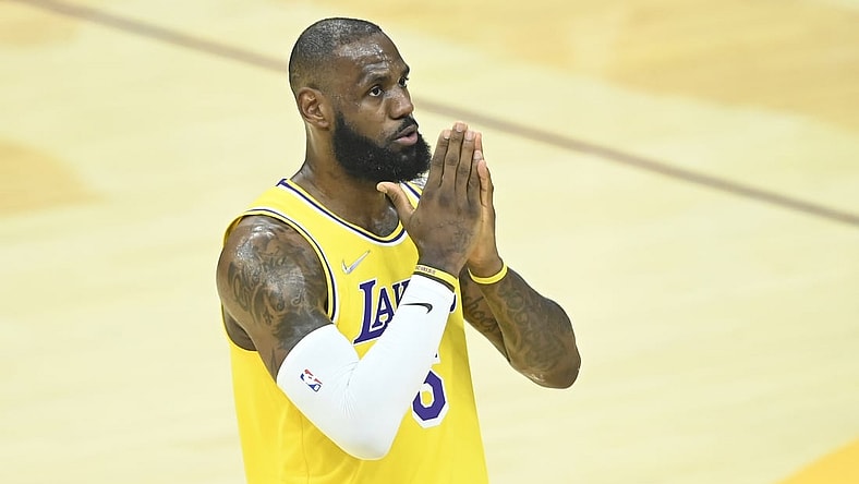 Mar 21, 2022; Cleveland, Ohio, USA; Los Angeles Lakers forward LeBron James (6) reacts to cheers in the first quarter against the Cleveland Cavaliers at Rocket Mortgage FieldHouse. Mandatory Credit: David Richard-USA TODAY Sports