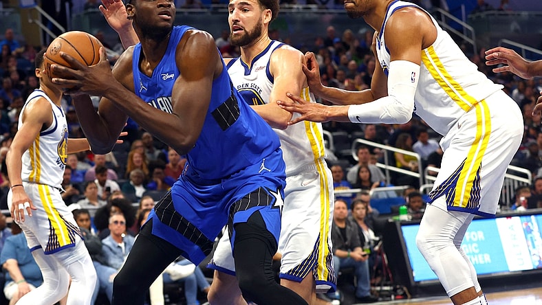 Mar 22, 2022; Orlando, Florida, USA; Orlando Magic center Mo Bamba (5) drives to the basket as Golden State Warriors guard Klay Thompson (11) defends during the second half at Amway Center. Mandatory Credit: Kim Klement-USA TODAY Sports