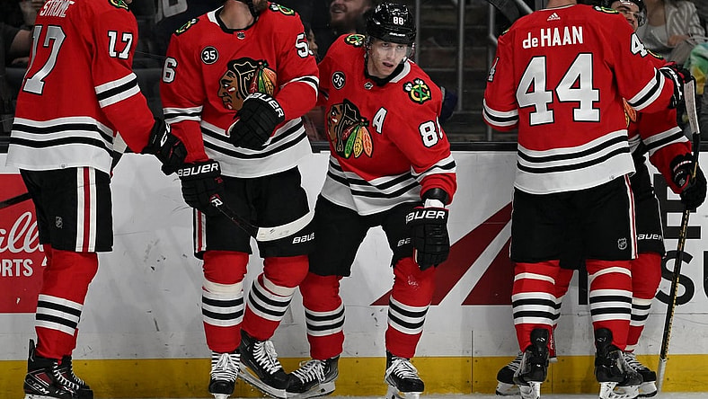Mar 24, 2022; Los Angeles, California, USA;  Chicago Blackhawks center Dylan Strome (17), defenseman Erik Gustafsson (56), defenseman Calvin de Haan (44) and left wing Alex DeBrincat (12) celebrate after a goal by right wing Patrick Kane (88) in the first period at Crypto.com Arena. Mandatory Credit: Jayne Kamin-Oncea-USA TODAY Sports