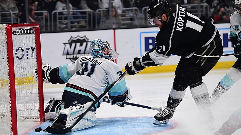 Mar 26, 2022; Los Angeles, California, USA; Los Angeles Kings center Anze Kopitar (11) scores a goal against Seattle Kraken goaltender Philipp Grubauer (31) during the second period at Crypto.com Arena. Mandatory Credit: Gary A. Vasquez-USA TODAY Sports
