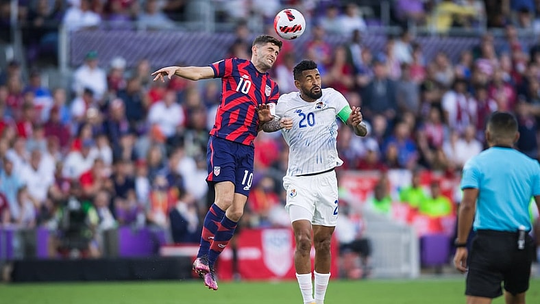Mar 27, 2022; Orlando, Florida, USA; United States forward Christian Pulisic (10) battles for the ball against Panama midfielder Anibal Godoy (20) in the first half during a FIFA World Cup Qualifier soccer match at Exploria Stadium. Mandatory Credit: Jeremy Reper-USA TODAY Sports