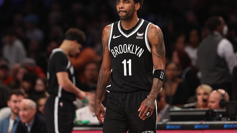 Mar 27, 2022; Brooklyn, New York, USA; Brooklyn Nets guard Kyrie Irving (11) walks on to the court after a time-out during the second half against the Charlotte Hornets at Barclays Center. Mandatory Credit: Vincent Carchietta-USA TODAY Sports