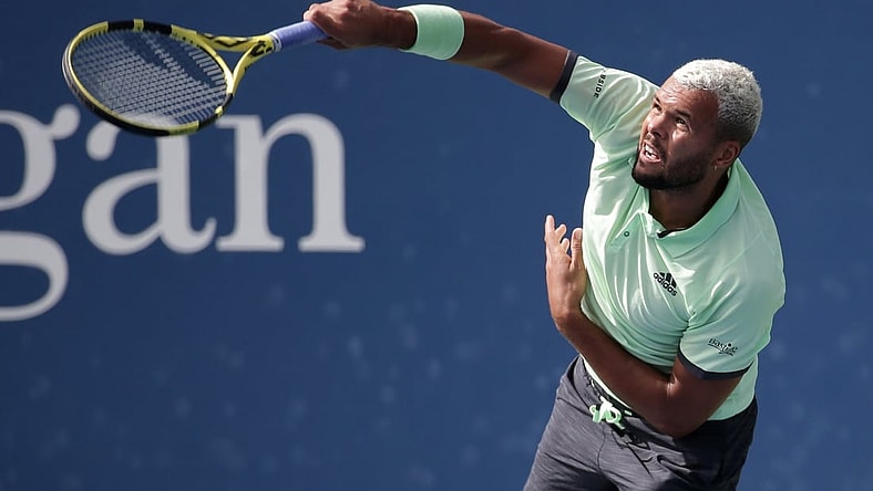 Aug 27, 2019; Flushing, NY, USA; Jo-Wilfried Tsonga of France hits to Tennys Sandgren of the United States in a first round match on day two of the 2019 U.S. Open tennis tournament at USTA Billie Jean King National Tennis Center. Mandatory Credit: Jerry Lai-USA TODAY Sports
