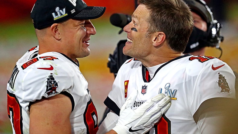 Feb 7, 2021; Tampa, FL, USA;  Tampa Bay Buccaneers quarterback Tom Brady (12) and Tampa Bay Buccaneers tight end Rob Gronkowski (87) celebrate after beating the Kansas City Chiefs in Super Bowl LV at Raymond James Stadium.  Mandatory Credit: Mark J. Rebilas-USA TODAY Sports