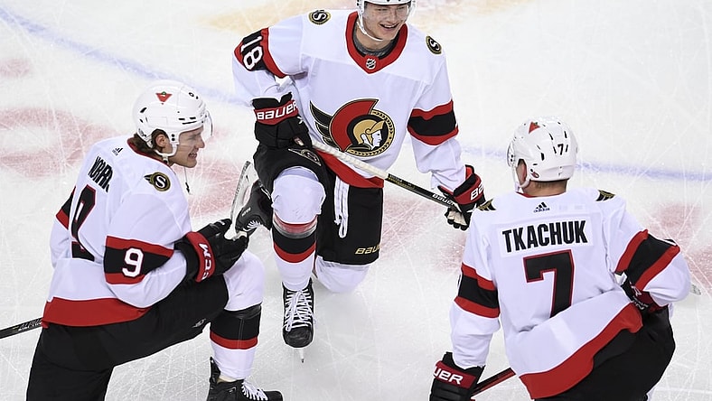 Mar 4, 2021; Calgary, Alberta, CAN; Ottawa Senators forward Josh Norris (9) forward Tim Stuetzle (18) and forward Brady Tkachuk (7) warm up against the Calgary Flames at Scotiabank Saddledome. Mandatory Credit: Candice Ward-USA TODAY Sports