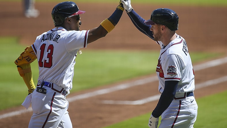 May 22, 2021; Atlanta, Georgia, USA; Atlanta Braves right fielder Ronald Acuna Jr. (13) celebrates after a home run with first baseman Freddie Freeman (5) against the Pittsburgh Pirates in the first inning at Truist Park. Mandatory Credit: Brett Davis-USA TODAY Sports