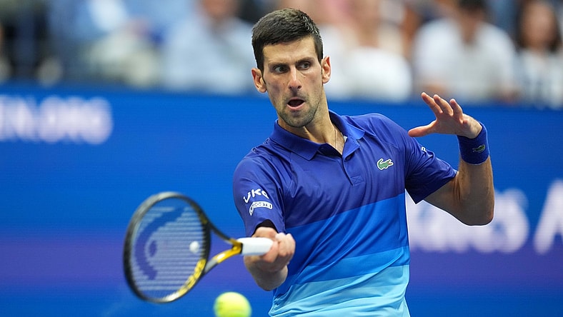 Sep 12, 2021; Flushing, NY, USA; Novak Djokovic of Serbia hits a forehand against Daniil Medvedev of Russia (not pictured) in the men's singles final on day fourteen of the 2021 U.S. Open tennis tournament at USTA Billie Jean King National Tennis Center. Mandatory Credit: Danielle Parhizkaran-USA TODAY Sports