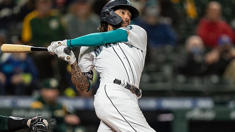 Sep 27, 2021; Seattle, Washington, USA;  Seattle Mariners rightfielder Mitch Haniger (17) takes a swing during an at-bat in a game against the Oakland Athletics at T-Mobile Park. The Mariners won 13-4. Mandatory Credit: Stephen Brashear-USA TODAY Sports