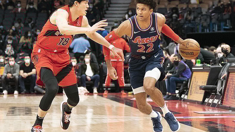 Dec 28, 2021; Toronto, Ontario, CAN; Philadelphia 76ers guard Matisse Thybulle (22) controls the ball as Toronto Raptors forward Yuta Watanabe (18) tries to defend during the first quarter at Scotiabank Arena. Mandatory Credit: Nick Turchiaro-USA TODAY Sports