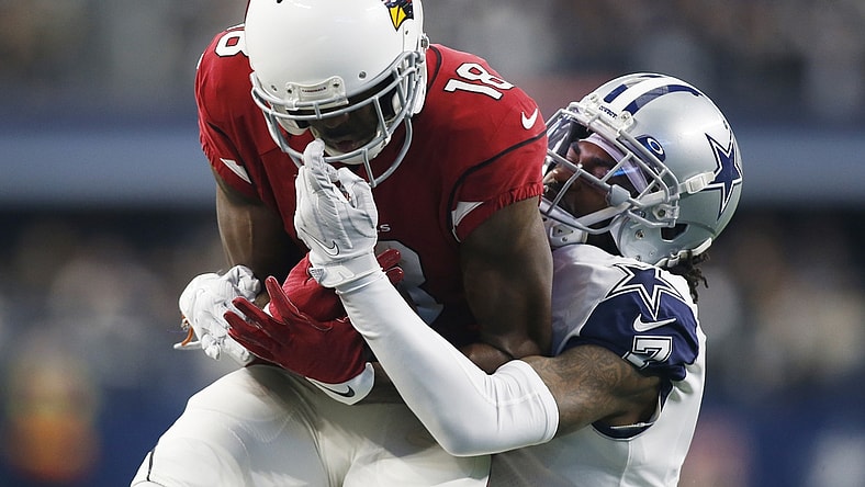 Jan 2, 2022; Arlington, Texas, USA; Arizona Cardinals wide receiver A.J. Green (18) catches a pass against Dallas Cowboys cornerback Trevon Diggs (7) in the first quarter at AT&T Stadium. Mandatory Credit: Tim Heitman-USA TODAY Sports