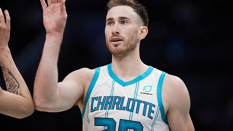 Jan 5, 2022; Charlotte, North Carolina, USA; Charlotte Hornets forward Gordon Hayward (20) high fives a teammate during second half action against the Detroit Pistons at Spectrum Center. Mandatory Credit: Brian Westerholt-USA TODAY Sports