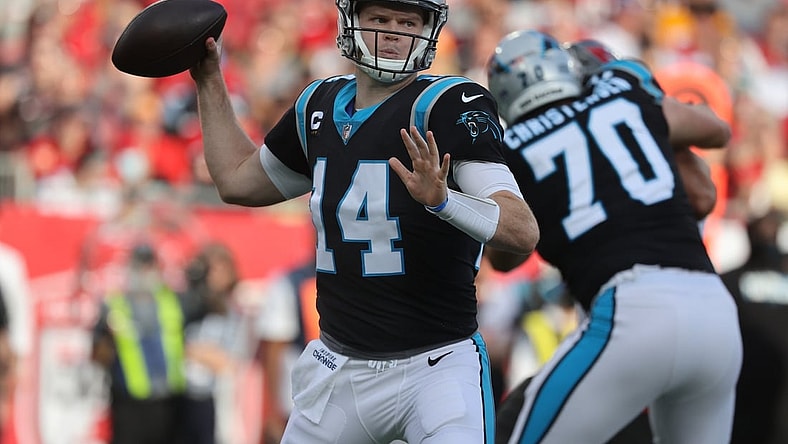 Jan 9, 2022; Tampa, Florida, USA; Carolina Panthers quarterback Sam Darnold (14) throws the ball against the Tampa Bay Buccaneers during the first quarter at Raymond James Stadium. Mandatory Credit: Kim Klement-USA TODAY Sports