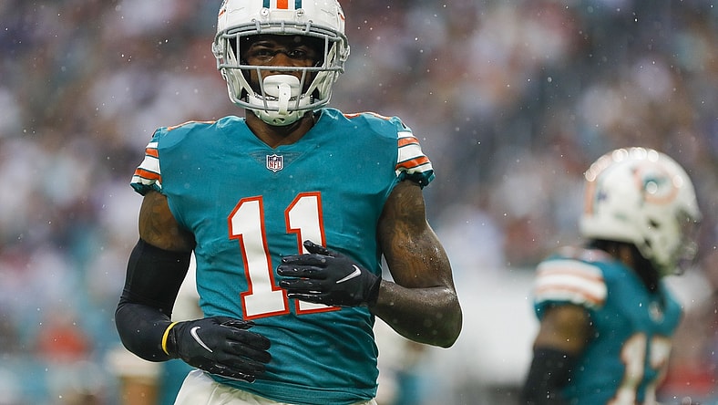 Jan 9, 2022; Miami Gardens, Florida, USA; Miami Dolphins wide receiver DeVante Parker (11) watches from the field during the second quarter of the game against the New England Patriots at Hard Rock Stadium. Mandatory Credit: Sam Navarro-USA TODAY Sports