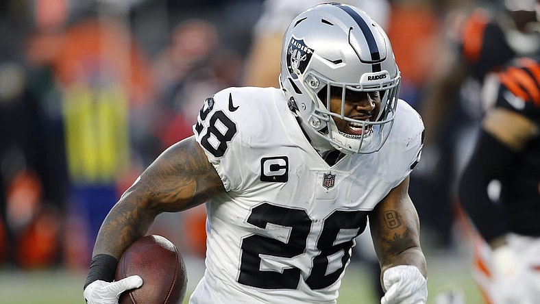 Jan 15, 2022; Cincinnati, Ohio, USA; Las Vegas Raiders running back Josh Jacobs (28) runs during the second quarter in an AFC Wild Card playoff football game against the Cincinnati Bengals at Paul Brown Stadium. Mandatory Credit: Joseph Maiorana-USA TODAY Sports