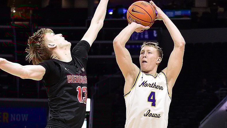 Mar 4, 2022; St. Louis, MO, USA; Northern Iowa Panthers guard AJ Green (4) shoots as Illinois State Redbirds forward Liam McChesney (13) defends during the first half in the quarterfinals round of the Missouri Valley Conference Tournament at Enterprise Center. Mandatory Credit: Jeff Curry-USA TODAY Sports