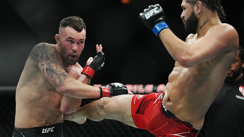 Mar 5, 2022; Las Vegas, Nevada, UNITED STATES; Colby Covington (red gloves) fights Jorge Masvidal (blue gloves) during UFC 272 at T-Mobile Arena. Mandatory Credit: Stephen R. Sylvanie-USA TODAY Sports