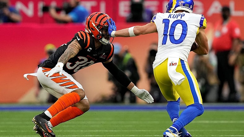 Los Angeles Rams wide receiver Cooper Kupp (10) stiff arms Cincinnati Bengals free safety Jessie Bates (30) after a catch in the first quarter during Super Bowl 56, Sunday, Feb. 13, 2022, at SoFi Stadium in Inglewood, Calif. The Cincinnati Bengals lost, 23-20.

Nfl Super Bowl 56 Los Angeles Rams Vs Cincinnati Bengals Feb 13 2022 0676