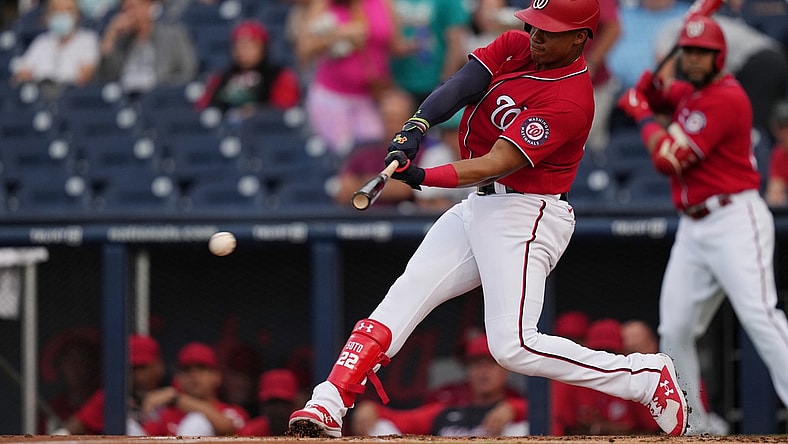Mar 24, 2022; West Palm Beach, Florida, USA; Washington Nationals right fielder Juan Soto (22) hits an RBI single in the 1st inning of the spring training game against the Houston Astros at The Ballpark of the Palm Beaches. Mandatory Credit: Jasen Vinlove-USA TODAY Sports