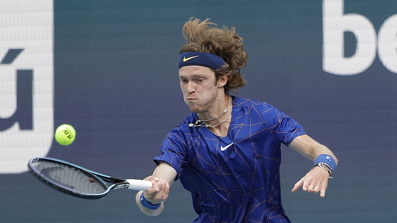 Mar 25, 2022; Miami Gardens, FL, USA; Andrey Rublev hits a forehand against Nick Krygios (not pictured) in a second round men's match in the Miami Open at Hard Rock Stadium. Mandatory Credit: Geoff Burke-USA TODAY Sports