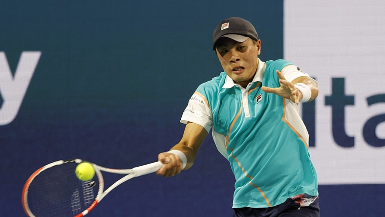 Mar 25, 2022; Miami Gardens, FL, USA; Brandon Nakashima (USA) hits a forehand against Frances Tiafoe (USA) (not pictured) in a second round men's singles match in the Miami Open at Hard Rock Stadium. Mandatory Credit: Geoff Burke-USA TODAY Sports