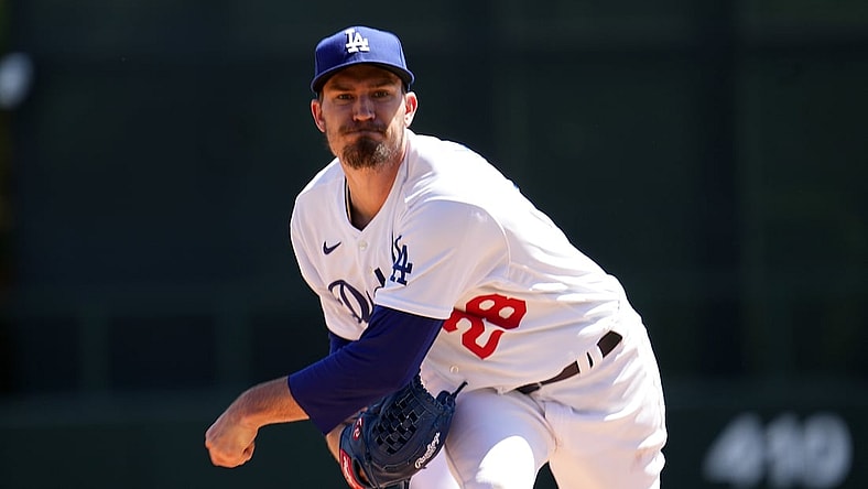 Mar 27, 2022; Phoenix, Arizona, USA; Los Angeles Dodgers starting pitcher Andrew Heaney (28) pitches against the Chicago White Sox during the first inning of a spring training game at Camelback Ranch-Glendale. Mandatory Credit: Joe Camporeale-USA TODAY Sports