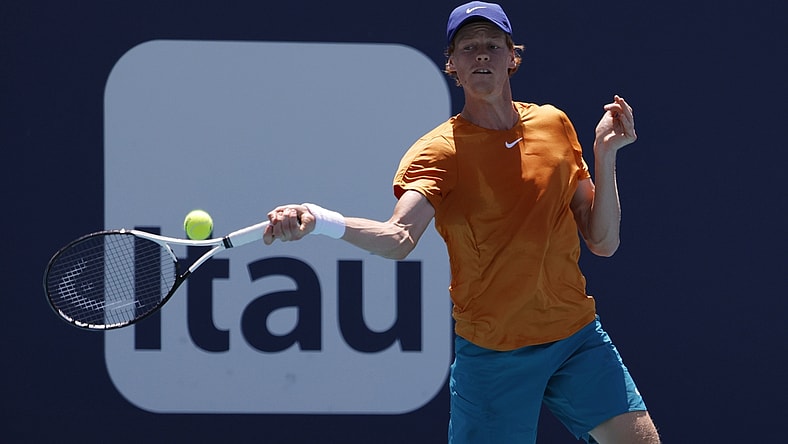 Mar 29, 2022; Miami Gardens, FL, USA; Jannik Sinner (ITA) hits a forehand against Nick Kyrgios (AUS)(not pictured) in a fourth round men's singles match in the Miami Open at Hard Rock Stadium. Mandatory Credit: Geoff Burke-USA TODAY Sports