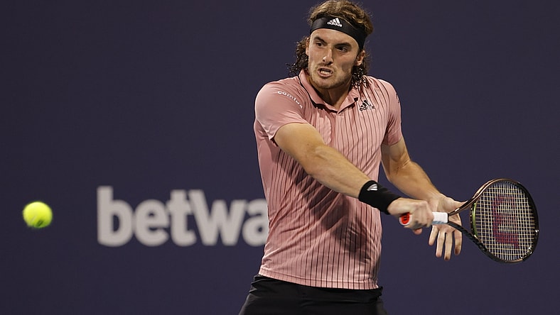 Mar 29, 2022; Miami Gardens, FL, USA; Stefanos Tsitsipas (GRE) hits a backhand against Carlos Alcaraz (ESP)(not pictured) in a men's fourth round men's singles match in the Miami Open at Hard Rock Stadium. Mandatory Credit: Geoff Burke-USA TODAY Sports