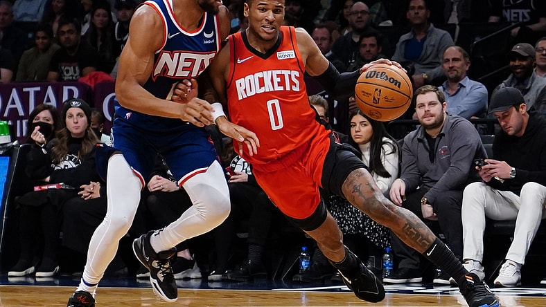 Apr 5, 2022; Brooklyn, New York, USA; Houston Rockets shooting guard Jalen Green (0) dribbles the ball against Brooklyn Nets small forward Bruce Brown (1) during the first half of the game at Barclays Center. Mandatory Credit: Gregory Fisher-USA TODAY Sports