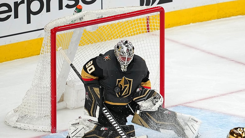 Apr 6, 2022; Las Vegas, Nevada, USA; Vegas Golden Knights goaltender Robin Lehner (90) makes a save against the Vancouver Canucks during the third period at T-Mobile Arena. Mandatory Credit: Stephen R. Sylvanie-USA TODAY Sports