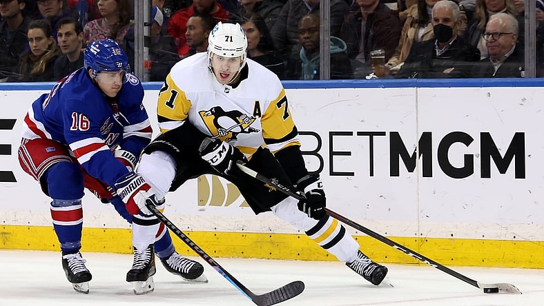 Apr 7, 2022; New York, New York, USA; Pittsburgh Penguins center Evgeni Malkin (71) controls the puck against New York Rangers center Ryan Strome (16) during the second period at Madison Square Garden. Mandatory Credit: Brad Penner-USA TODAY Sports