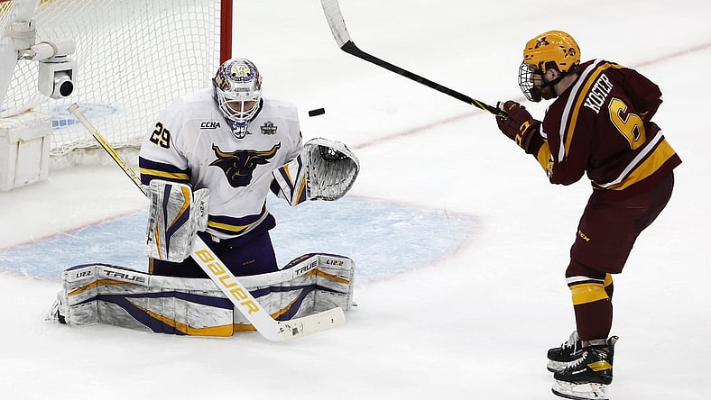 Apr 7, 2022; Boston, MA, USA; Minnesota State goaltender Dryden McKay (29) makes a save as Minnesota defenseman Mike Koster (6) looks for the rebound during the third period of the 2022 Frozen Four college ice hockey national semifinals at TD Garden. Mandatory Credit: Winslow Townson-USA TODAY Sports