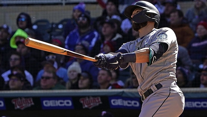 Apr 8, 2022; Minneapolis, Minnesota, USA;  Seattle Mariners right fielder Mitch Haniger (17) hits a two-run home run off of Minnesota Twins starting pitcher Joe Ryan (41) during the first inning at Target Field. Mandatory Credit: Nick Wosika-USA TODAY Sports